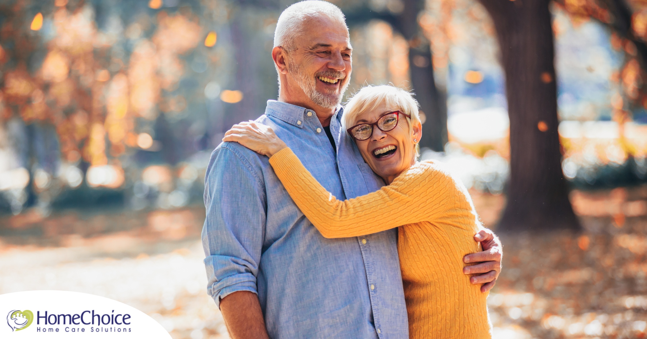 An older couple enjoys being outside in the fall, representing the idea of different fall activities for seniors.