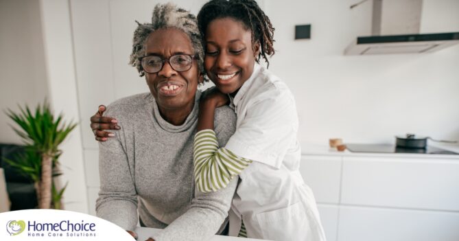 A caregiver hugs a client, representing the science of caregiving and how latest research can help provide quality care.