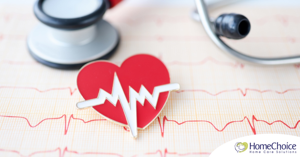 A heart symbol with an electrocardiogram line, an electrocardiogram sheet, and a stethoscope represents heart health.